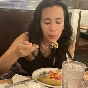 Lou Malnati's Pizzeria - Pretty girl eats Deep Dish The Lou - Pizza Near Me - Elk Grove, Illinois Lou Malnati's Pizzeria - Pretty girl eats Deep Dish The Lou - Pizza Near Me - Elk Grove, Illinois