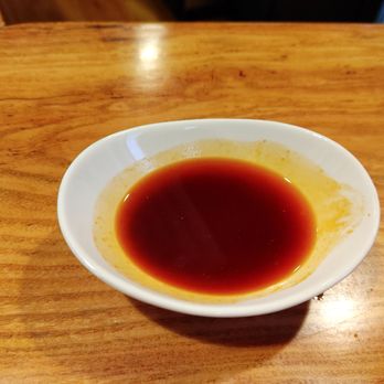 Bokujo - Chili oil to keep it hot and spicy. A must, delicious. - Ramen Near Me - Rapid City, South Dakota