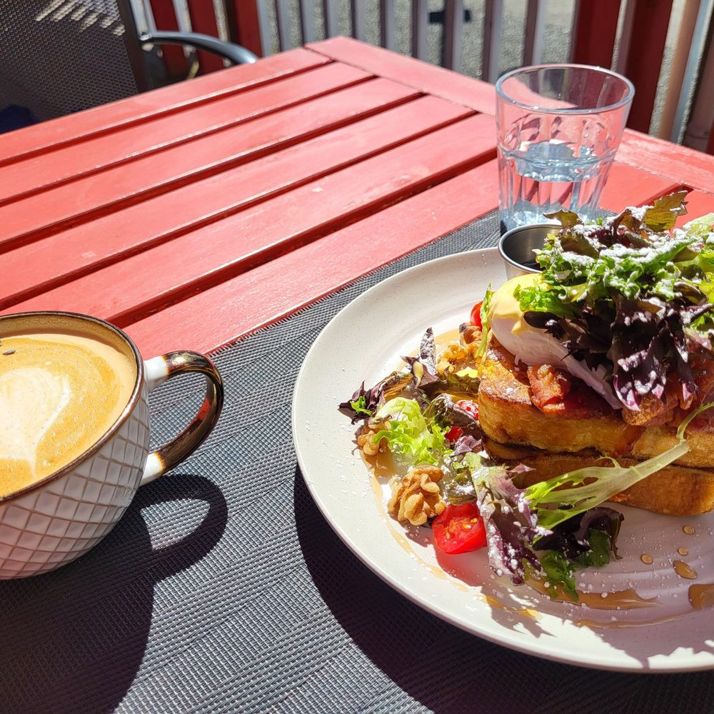 Cannery Cafe - Sweet & salty, French toast serve with soft poached egg/ hollandaise and salad on top - Canadian (New) Near Me - Richmond, British Columbia