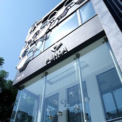 Perla Dental Clinics - Exterior view of Perla Dental Clinics building with Perla logo on the facade