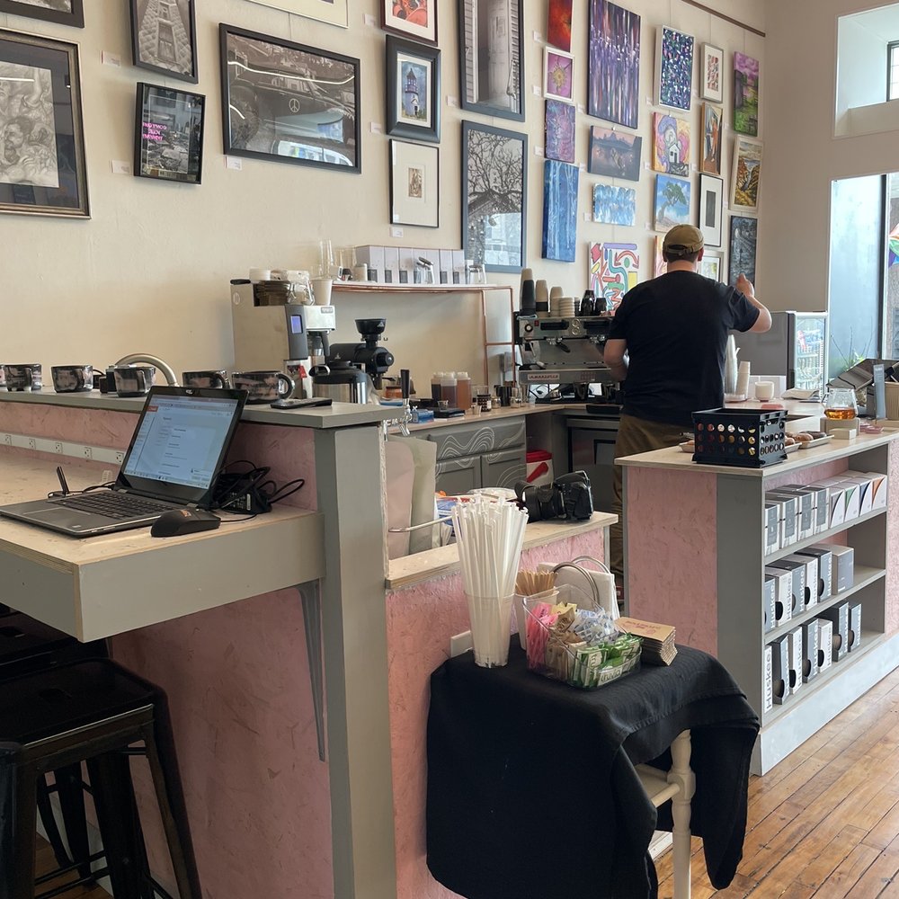 a man working in a coffee shop