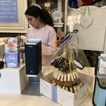 Nothing Bundt Cakes - a woman behind a counter - Desserts Near Me - Woodstock, Georgia Nothing Bundt Cakes - a woman behind a counter - Desserts Near Me - Woodstock, Georgia