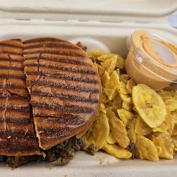 El Cubano - Sloppy Cubano Picadillo with plantain chips + their delicious side sauce