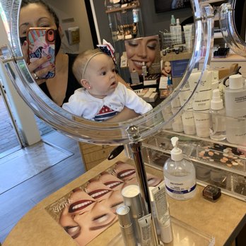 Merle Norman - Tustin - Checking out her new earrings - Cosmetics & Beauty Supply Near Me - Tustin, California