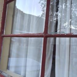 Redwood Cabin - Broken window, one of many broken single pane windows.
