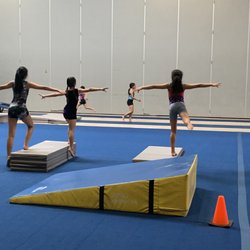 Rips & Ties Gymnastics - 3 students per coach.