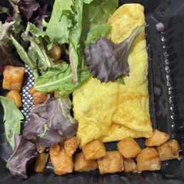 Veggie omelette with a few pieces of lettuce and potatoes. Very disappointing flavor and portion. Veggie omelette with a few pieces of lettuce and potatoes. Very disappointing flavor and portion.
