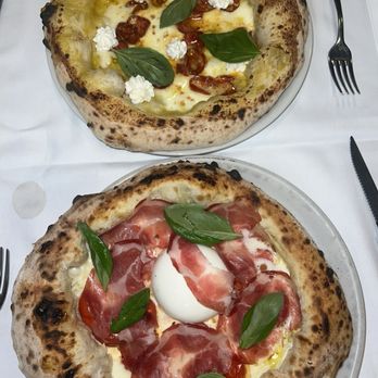 Piccolo Buco - Top: yellow sauce spicy salami pizza Bottom: White Sauce Burrata pizza Both are very good! - Italian Near Me - Rome, RM Piccolo Buco - Top: yellow sauce spicy salami pizza Bottom: White Sauce Burrata pizza Both are very good! - Italian Near Me - Rome, RM