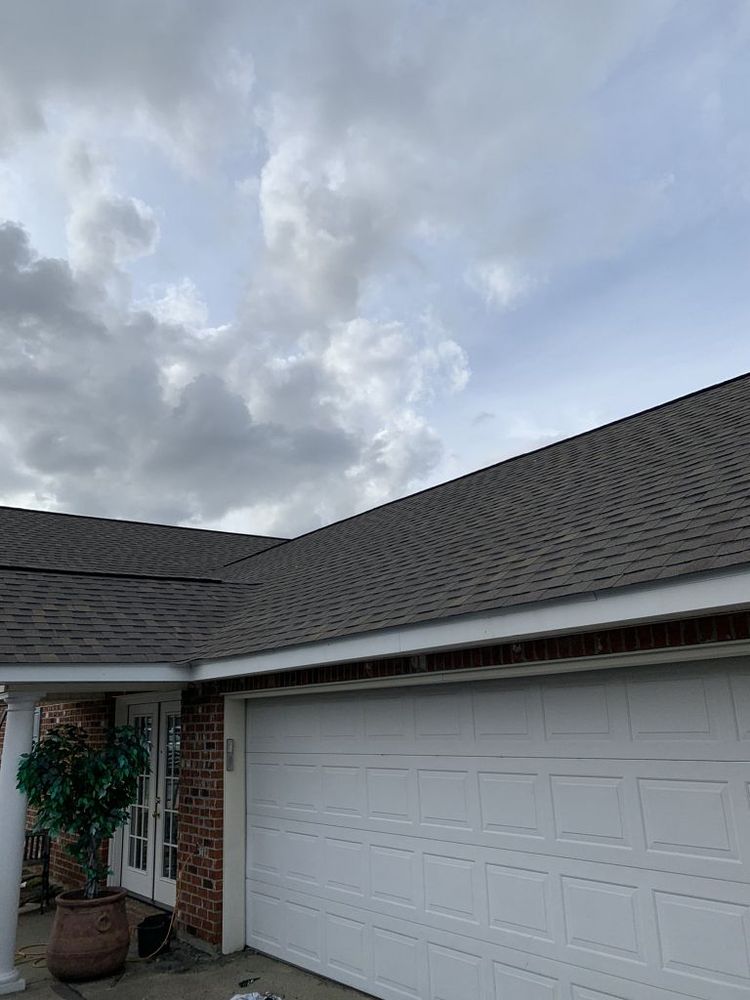 Slide of Pelican Roofing Company