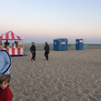 BeachFront Cinema - Portal potty just steps away from the concession stand - Outdoor Movies Near Me - Huntington Beach, California