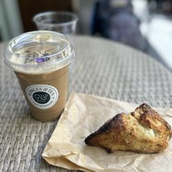 Bubbles & Tea Coffeehouse - Iced lavender latte with secret protein and a thyme goat cheese scone. Both delicious! Very cool spot.
