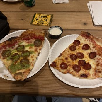 Pizza Lobo - West Loop - Sausage Slice with Pesto Drizzle, Pepperoni Slice with side of Ranch - Cocktail Bars Near Me - Chicago, Illinois Pizza Lobo - West Loop - Sausage Slice with Pesto Drizzle, Pepperoni Slice with side of Ranch - Cocktail Bars Near Me - Chicago, Illinois