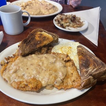 5 Loaves Country Kitchen - Chicken fried steak and in the background biscuits and gravy. - American Near Me - McPherson, Kansas