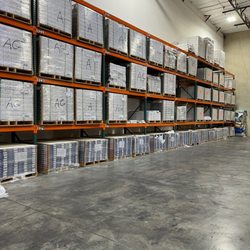 PG Long - Portland - Pg Long floor covering stock of luxury vinyl plank and tile in Portland, OR, warehouse.