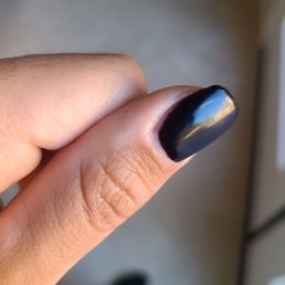 Sloppy work. This is a fresh set of acrylics that cost $60 and she didn't even bother to paint all the way to the edge of the cuticle.