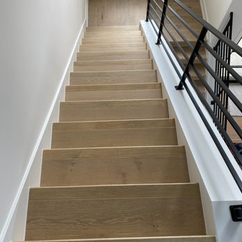 Superior Services - a staircase leading to a second floor - Flooring Near Me Superior Services - a staircase leading to a second floor - Flooring Near Me