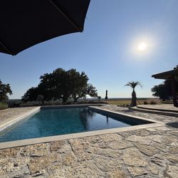 Diamond A Ranch - Beautiful pool area - with chaise lounges, pool toys, and plastic glassware for poolside libations.