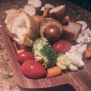 The Melting Pot - Assortment of breads, pretzels, veggies and fresh for the cheese fondue. - Fondue Near Me - Boca Raton, Florida The Melting Pot - Assortment of breads, pretzels, veggies and fresh for the cheese fondue. - Fondue Near Me - Boca Raton, Florida