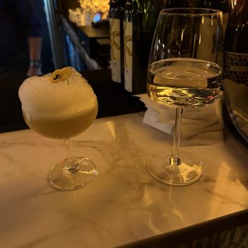 Rivayat - White wine and a nonalcoholic mocktail.  The mocktail was weird. Had a salty foam on top and was hot/spicy. - Indian Near Me - Charleston, South Carolina