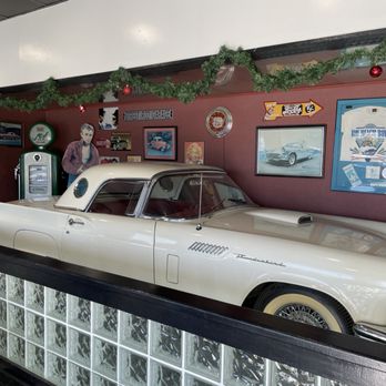 Pizza Parlor - a man standing next to a white car - Pizza Near Me - Kingsville, Texas Pizza Parlor - a man standing next to a white car - Pizza Near Me - Kingsville, Texas