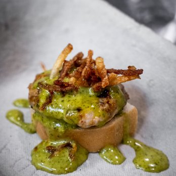 Tropical South - a sandwich covered in avocado sauce - Food Trucks Near Me - Etobicoke, Ontario