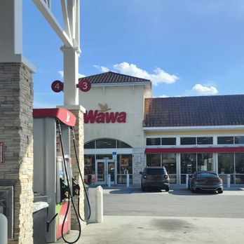 Wawa - Paying and activating the pump via the app. Using one of my available bonuses (15 cents off per gallon for plus grade and higher) - Gas Stations Near Me - Orlando, Florida