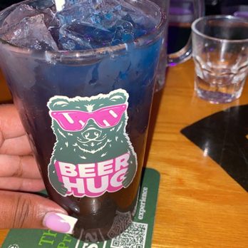 Rudy's Sports Bar - a person holding a drink - Sports Bars Near Me - Largo, Florida Rudy's Sports Bar - a person holding a drink - Sports Bars Near Me - Largo, Florida