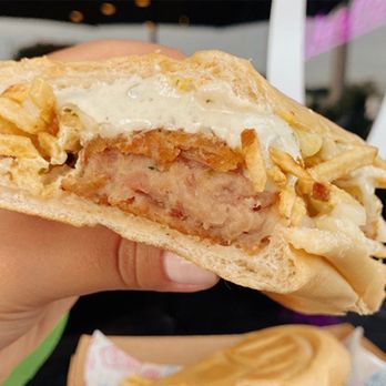 Dos Croquetas - Hialeah Pop up - a hand holding a sandwich - Cuban Near Me - Miami, Florida Dos Croquetas - Hialeah Pop up - a hand holding a sandwich - Cuban Near Me - Miami, Florida