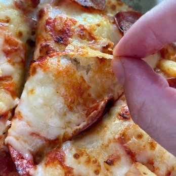 Domino's Pizza - a hand grabbing a slice of pizza - Pizza Near Me - Stafford, Virginia Domino's Pizza - a hand grabbing a slice of pizza - Pizza Near Me - Stafford, Virginia