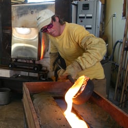Tandem Glass - Charlie pours molten glass into a casting.