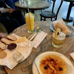 CAFE BOHEME - Food: Fromages du jour £10 and Myrtille crème brûlée £9. Cocktails: Spicy Mango £13 and Boheme Punch £13.5.