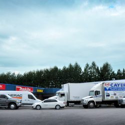 Jean-Claude Cayer Enterprises - All of our trucks in front of our store.