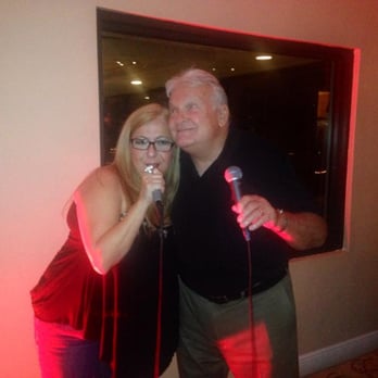 Lago Del Sol - Bistro Lounge - Lourdes and Doug belt out a tune at Charlie's Bistro during Friday during Friday night karaoke. Join the fun! - New American Near Me - Doral, Florida Lago Del Sol - Bistro Lounge - Lourdes and Doug belt out a tune at Charlie's Bistro during Friday during Friday night karaoke. Join the fun! - New American Near Me - Doral, Florida