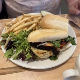 Pastrami sandwich and fries. Pastrami sandwich and fries.