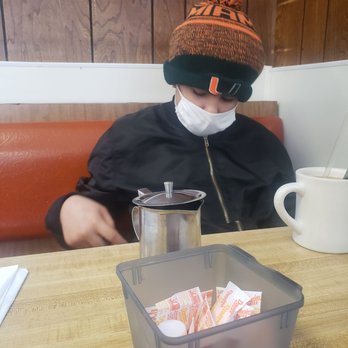Sparky's Restaurant - a person wearing a face mask - American Near Me - Central Falls, Rhode Island