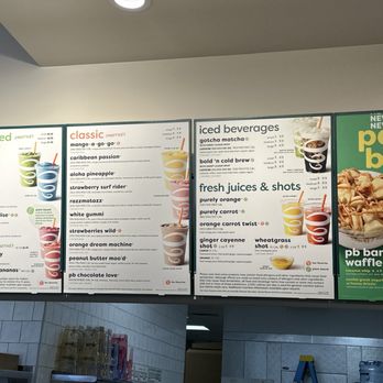 Jamba - Menu - A menu board at a juice bar features sections for plant-based smoothies, classic smoothies, iced beverages, fresh juices, and parfait bowls. - Juice Bars & Smoothies Near Me - Albuquerque, New Mexico