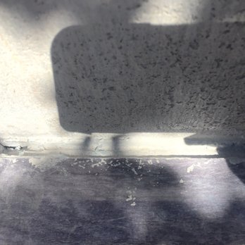 DST Flooring - Large gap between the wall and BBQ.  They thought a backsplash would hide it - Flooring Near Me - Palm Desert, California