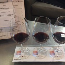 Vino Volo - Red wine flight. 2oz of 3 different wines with a description of each written on the coasters.