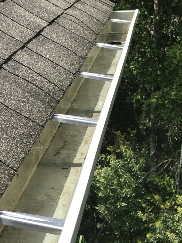 Slide of Gutter Clutter Cleaning & Roof Repair