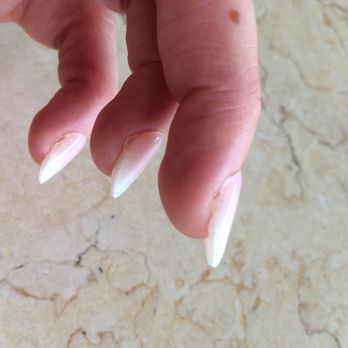Naillinis Spa - Never had nails that got this gross and ugly this quickly. It's been less than four days. They didn't look much better the first day tho. - Nail Salons Near Me - Orlando, Florida