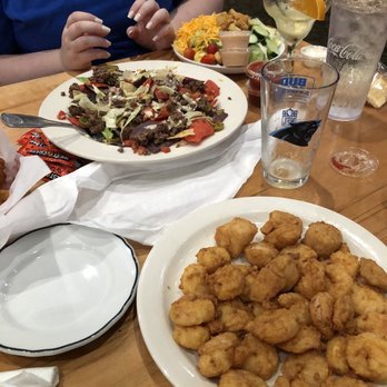 On The Rocks - Mound of nachos, shrimp and scallop platter, and dinner salad - Sports Bars Near Me - Atlantic Beach, North Carolina