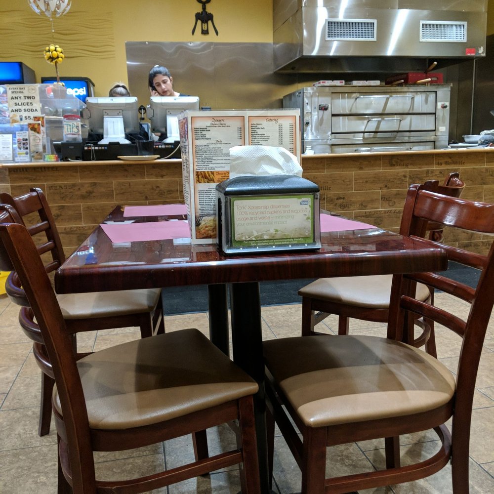 a table and chairs in a restaurant a table and chairs in a restaurant