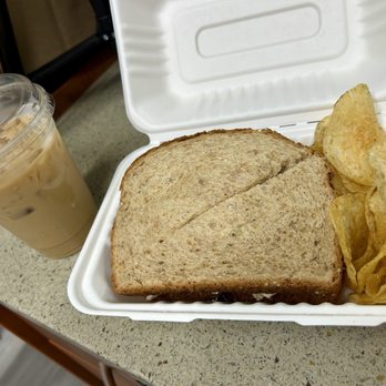 The Well Coffeehouse - An iced Georgia On My Mind latte with oat milk and a Mediterranean Veggie sandwich add avocado and add chicken with kettle chips - Coffee & Tea Near Me - Fishers, Indiana