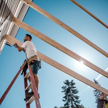 1040 Remodeling - a man on a ladder working on a roof - General Contractors Near Me - Kuna, Idaho