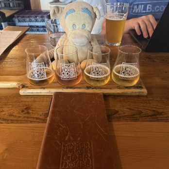 Finger Lakes Cider House - Flight of cider and beer in the back - Cideries Near Me - Interlaken, New York Finger Lakes Cider House - Flight of cider and beer in the back - Cideries Near Me - Interlaken, New York