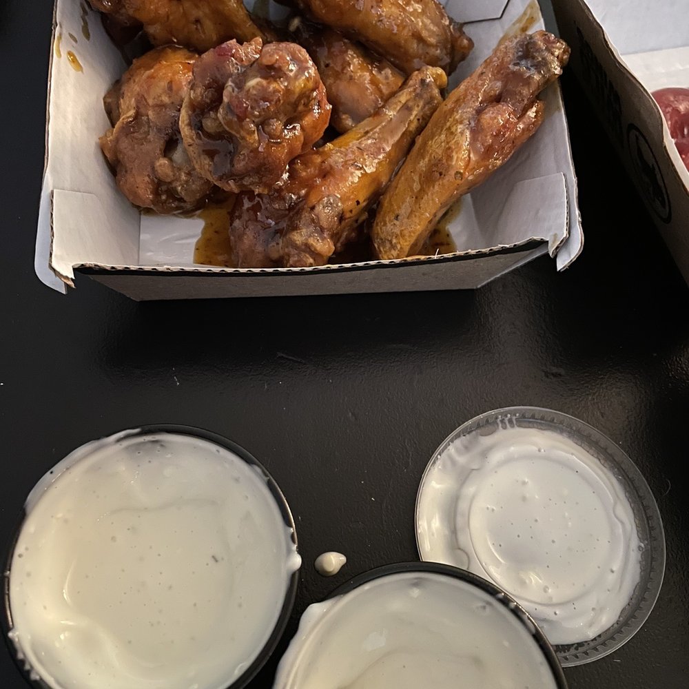 Buffalo Wild Wings - Half cups of blue cheese and my '10 Boneless Wings'. Don't order from them. Just tragic. - Chicken Wings Near Me - McKinney, Texas