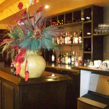 Kypreos Restaurant - a vase of flowers on the bar - Greek Near Me - Kitchener, Ontario