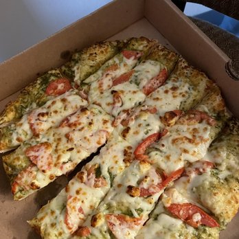 Palio's Pizza Cafe - Yummy green Greek Bread. Pesto spices and veggies. Light yet tasty. - Pizza Near Me - Granbury, Texas Palio's Pizza Cafe - Yummy green Greek Bread. Pesto spices and veggies. Light yet tasty. - Pizza Near Me - Granbury, Texas