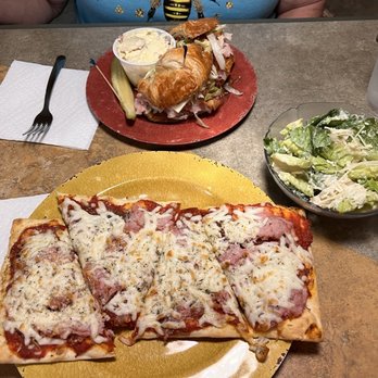 The Wild Flour Bistro - Flatbread with ham, pepperoni, onions. Caesar salad. Ham and cheese croissant with potato salad side. - Coffee & Tea Near Me - Elkin, North Carolina The Wild Flour Bistro - Flatbread with ham, pepperoni, onions. Caesar salad. Ham and cheese croissant with potato salad side. - Coffee & Tea Near Me - Elkin, North Carolina
