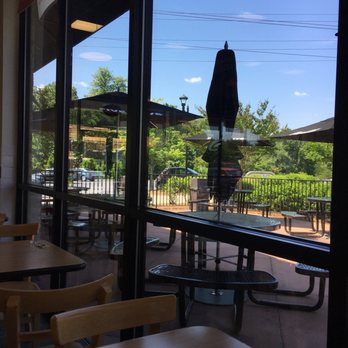 Five Guys - a view of a patio from a restaurant - Burgers Near Me - Winston-Salem, North Carolina Five Guys - a view of a patio from a restaurant - Burgers Near Me - Winston-Salem, North Carolina